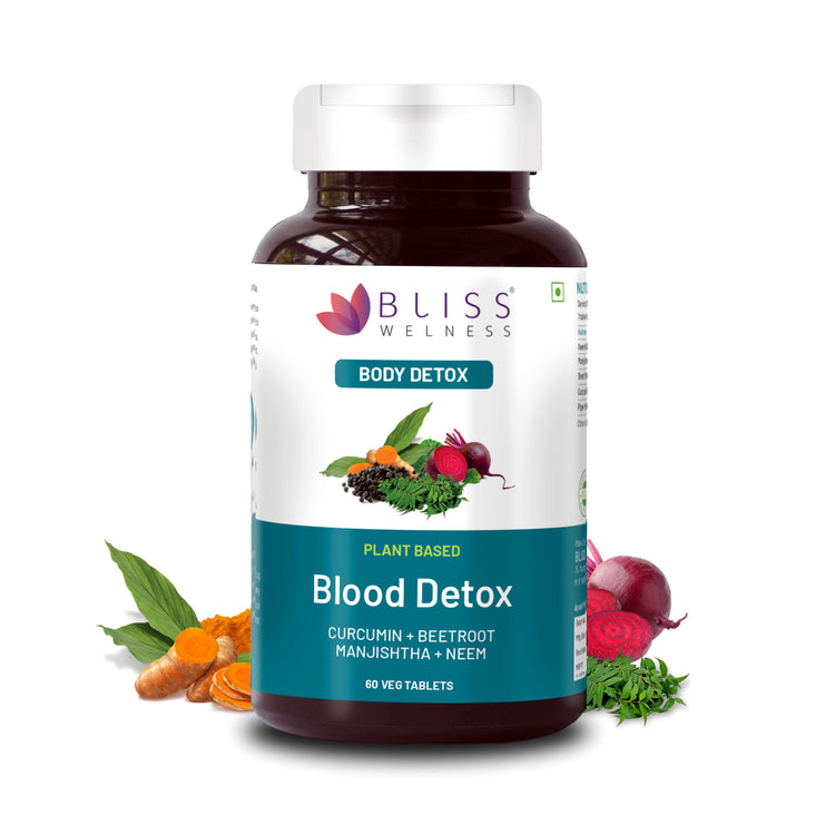 A bottle of Bliss Welness Blood Detox dietary supplement with images of beetroot, manjishtha, neem, and curcumin, indicating the ingredients of the product.