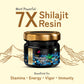 Jar of 7X Shilajit Resin with mountain and hand illustrations on a beige background